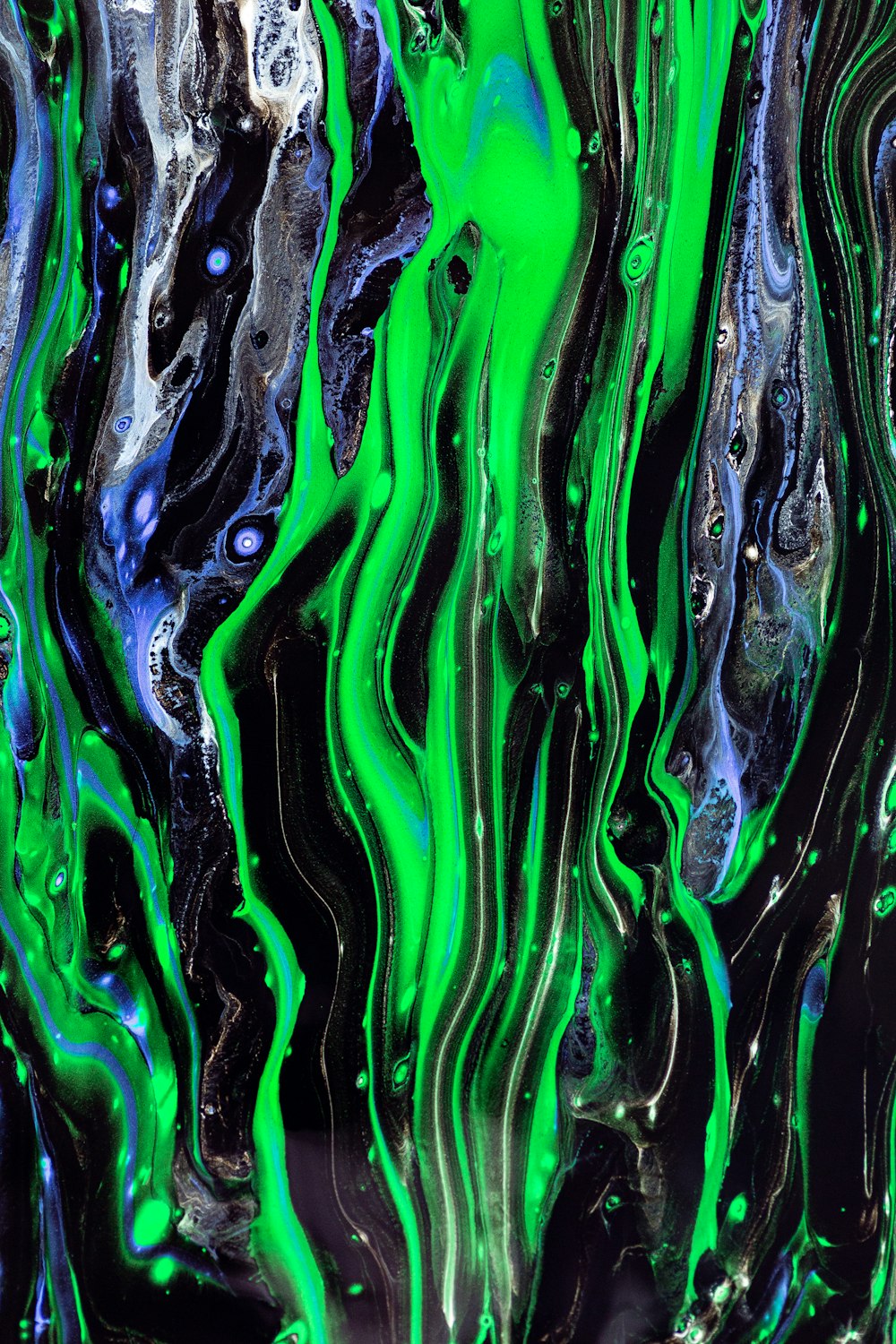 a green and black abstract painting
