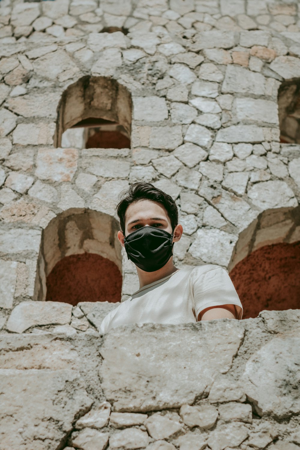 man in white shirt wearing black sunglasses