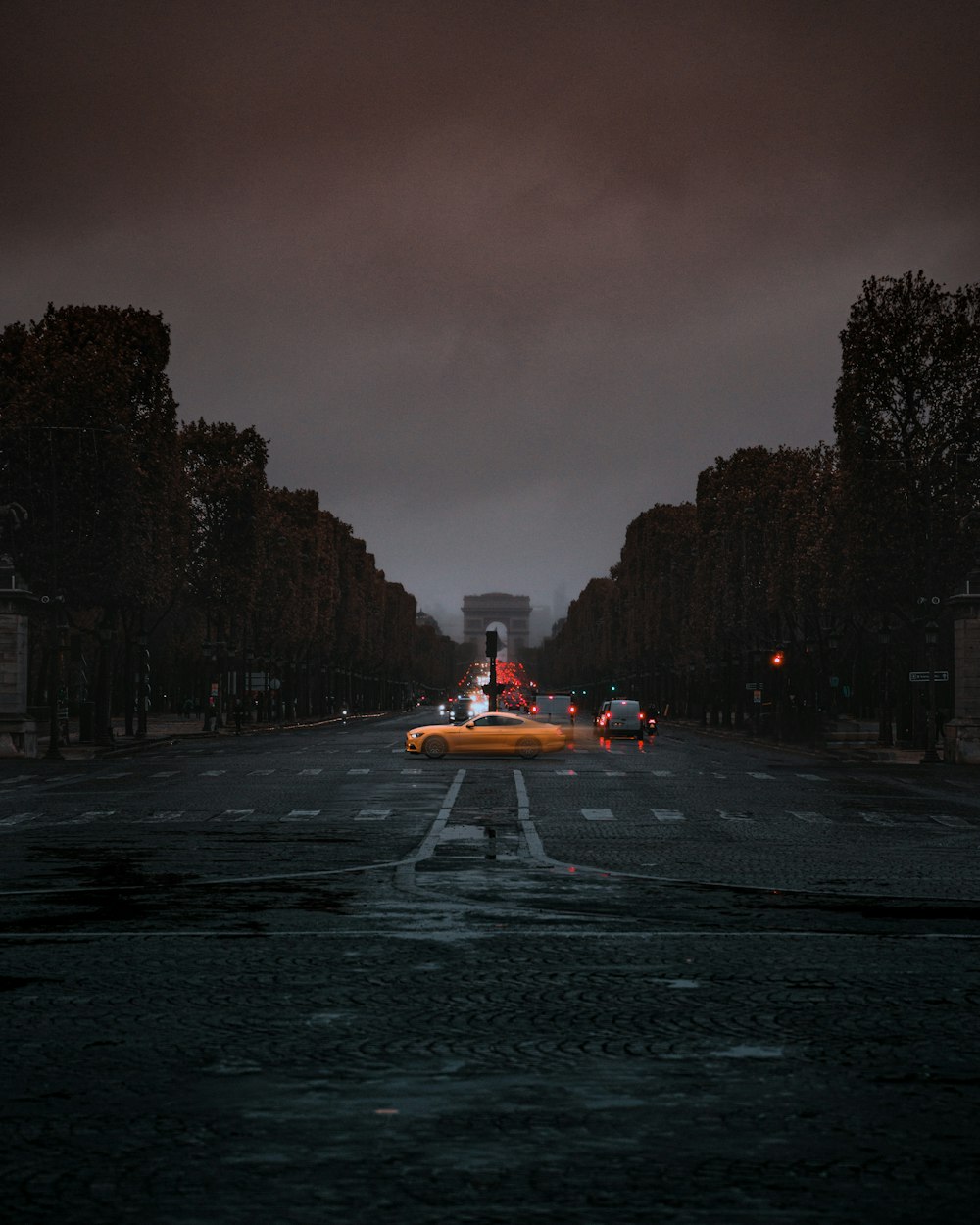 orange car on road during night time