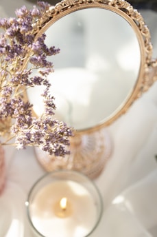 A serene space featuring a mirror surrounded by calming lavender tones.