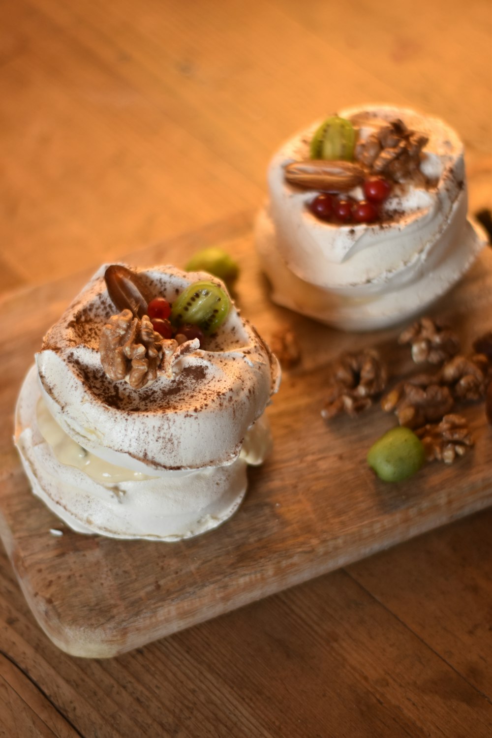 white icing covered cake on brown wooden table