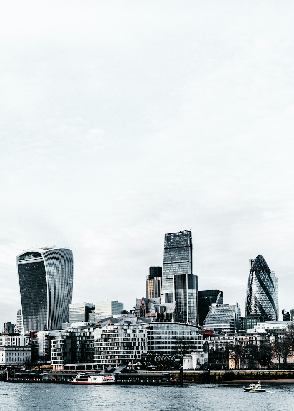 city skyline under white sky during daytime