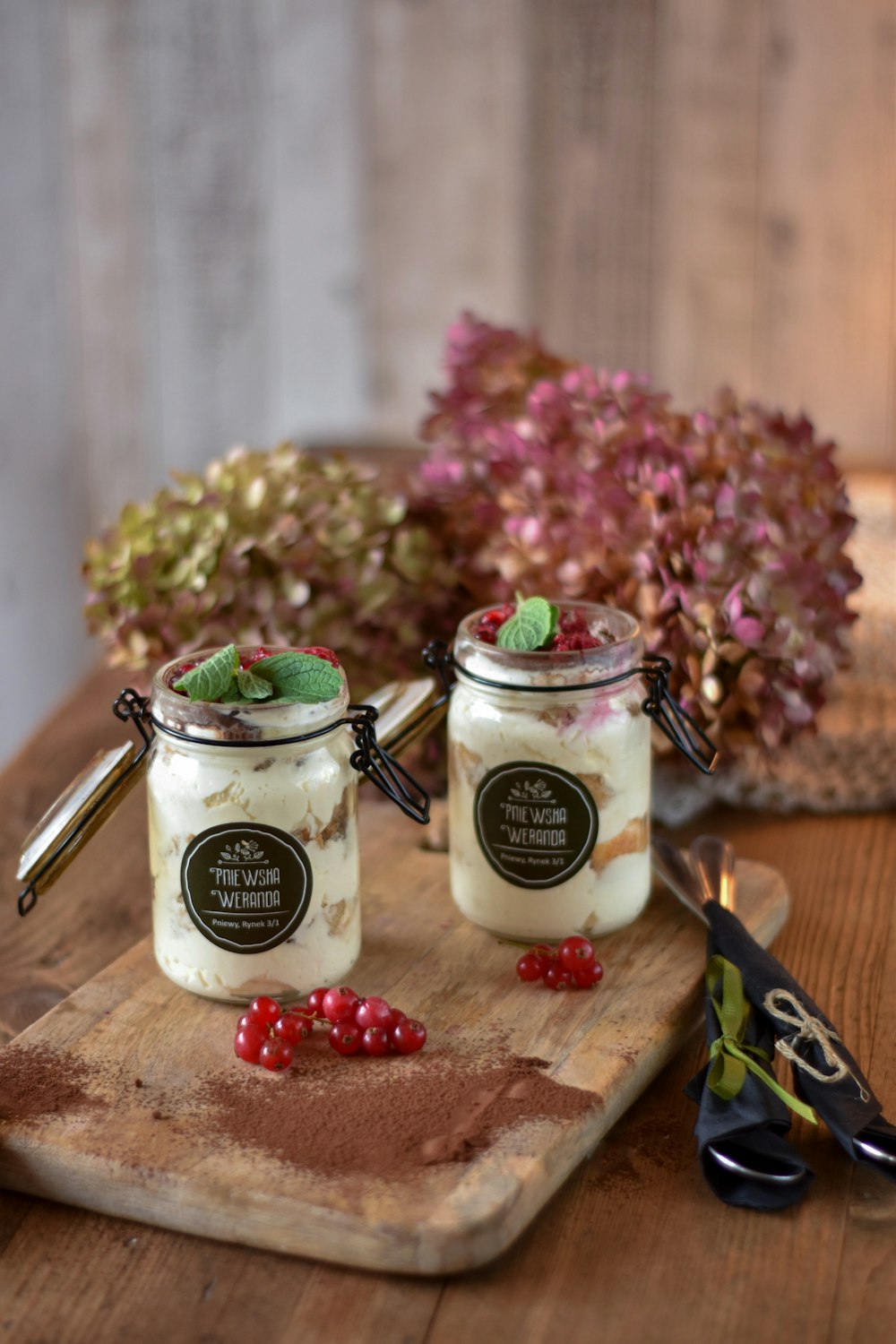 two clear glass jars on brown wooden chopping board