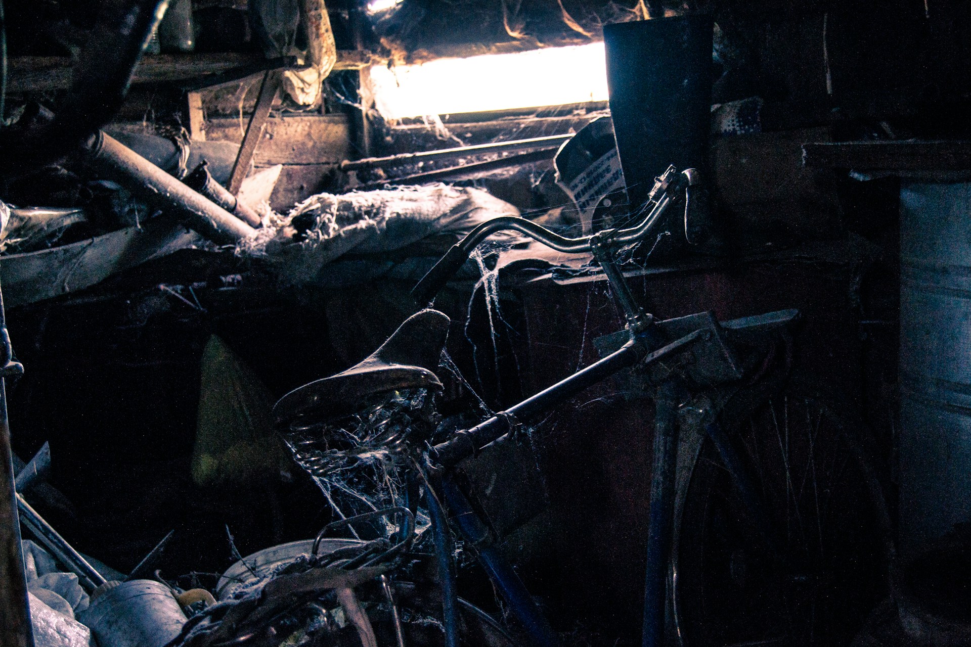 black bicycle near white wall