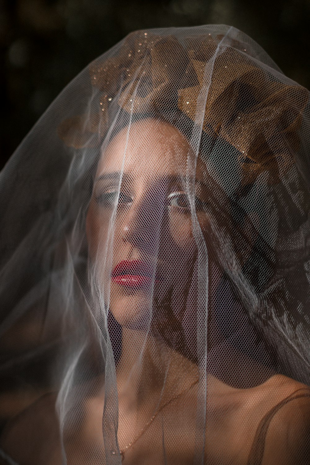 woman in white mesh veil