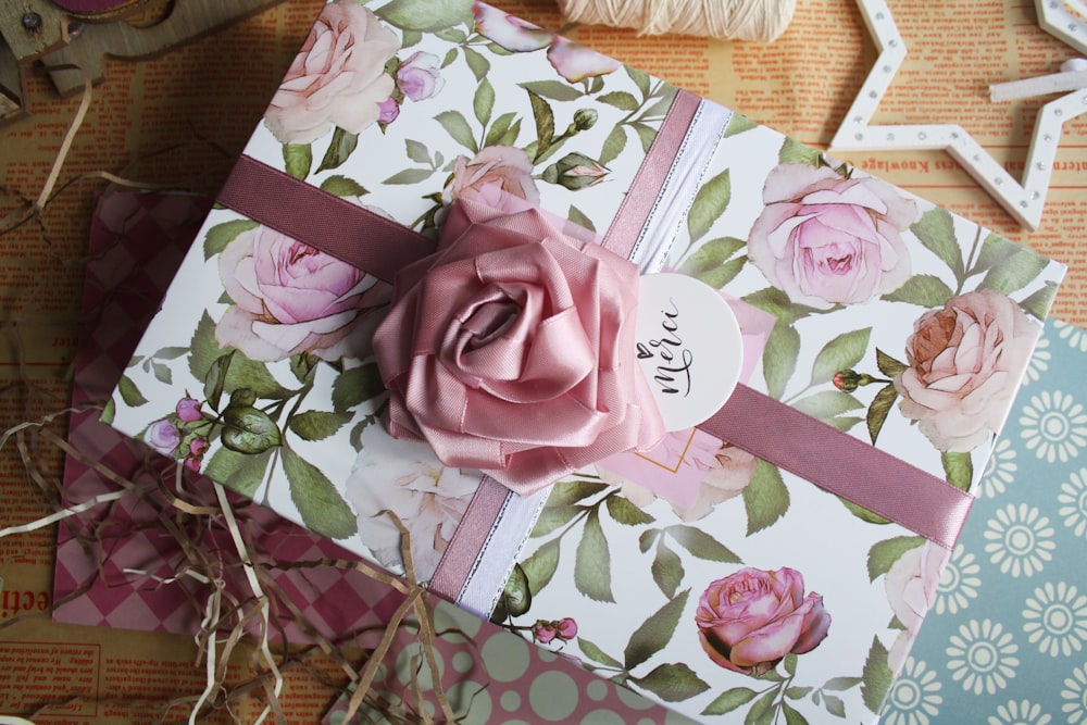 pink rose on brown wooden table