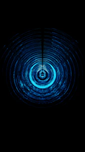 Close-up of a glowing ripple animation spreading from a button press on a dark interface.
