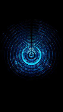 Close-up of a glowing ripple effect spreading across a button on a dark background.