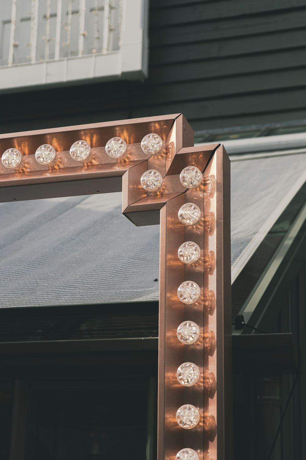 gold and silver round coins on brown wooden shelf