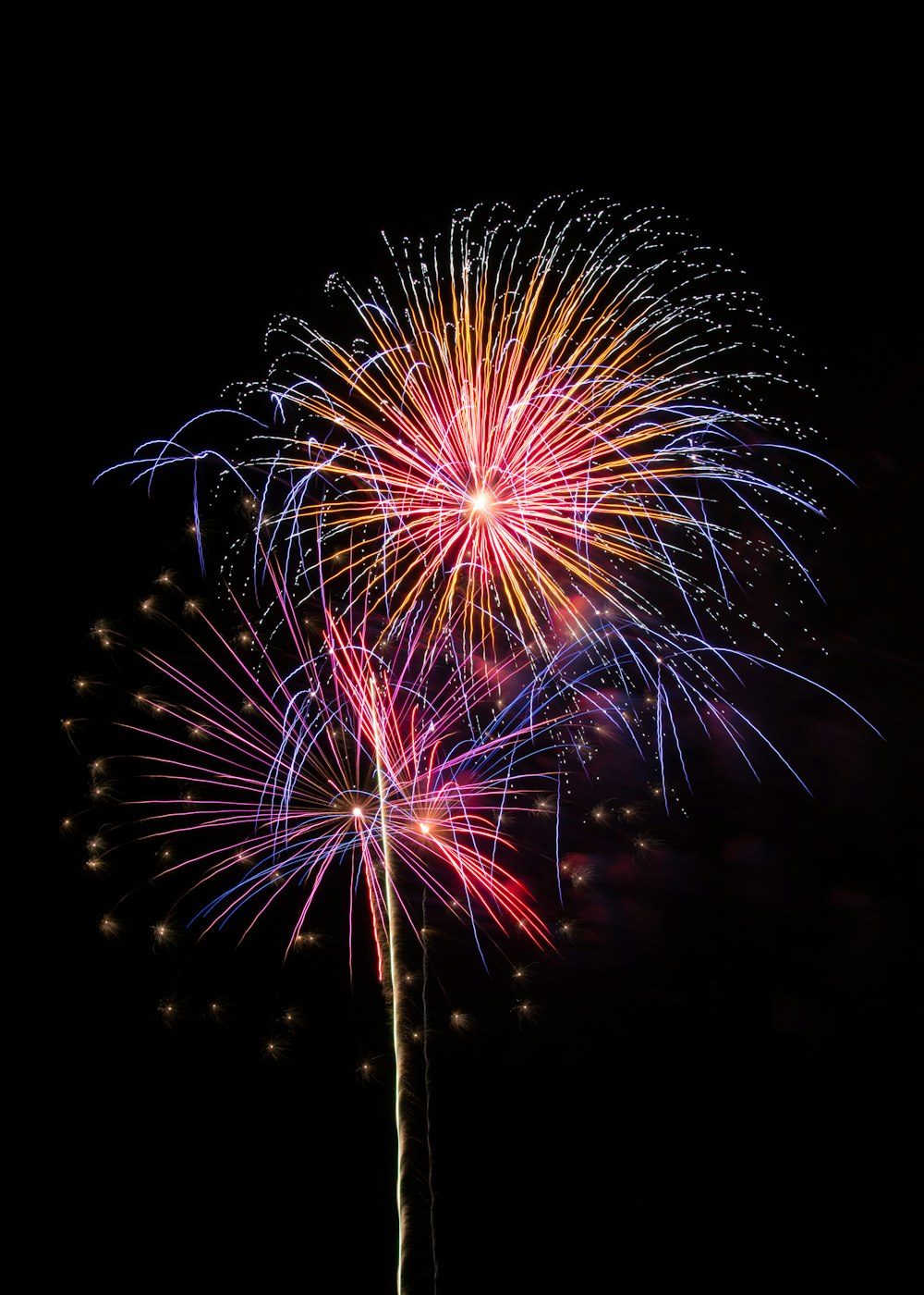 red and yellow fireworks display during nighttime