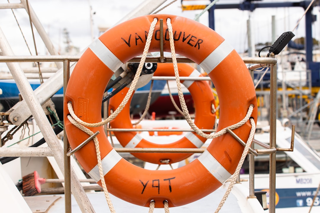 orange life buoy on white metal frame