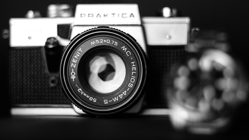 black and silver camera in grayscale photography