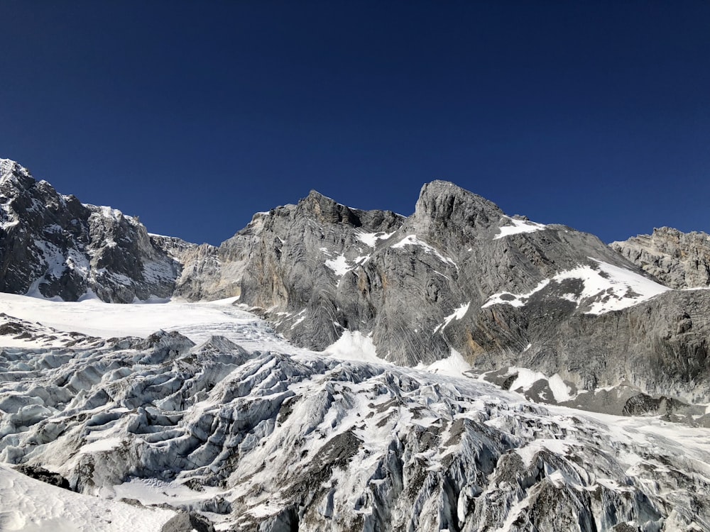 snow covered mountain under blue sky during daytime