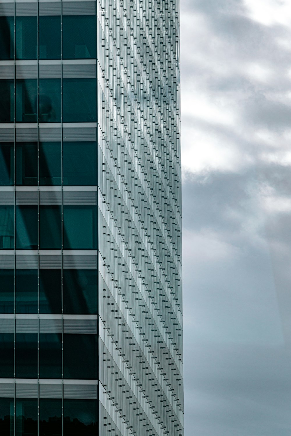 gray and white concrete building under gray clouds