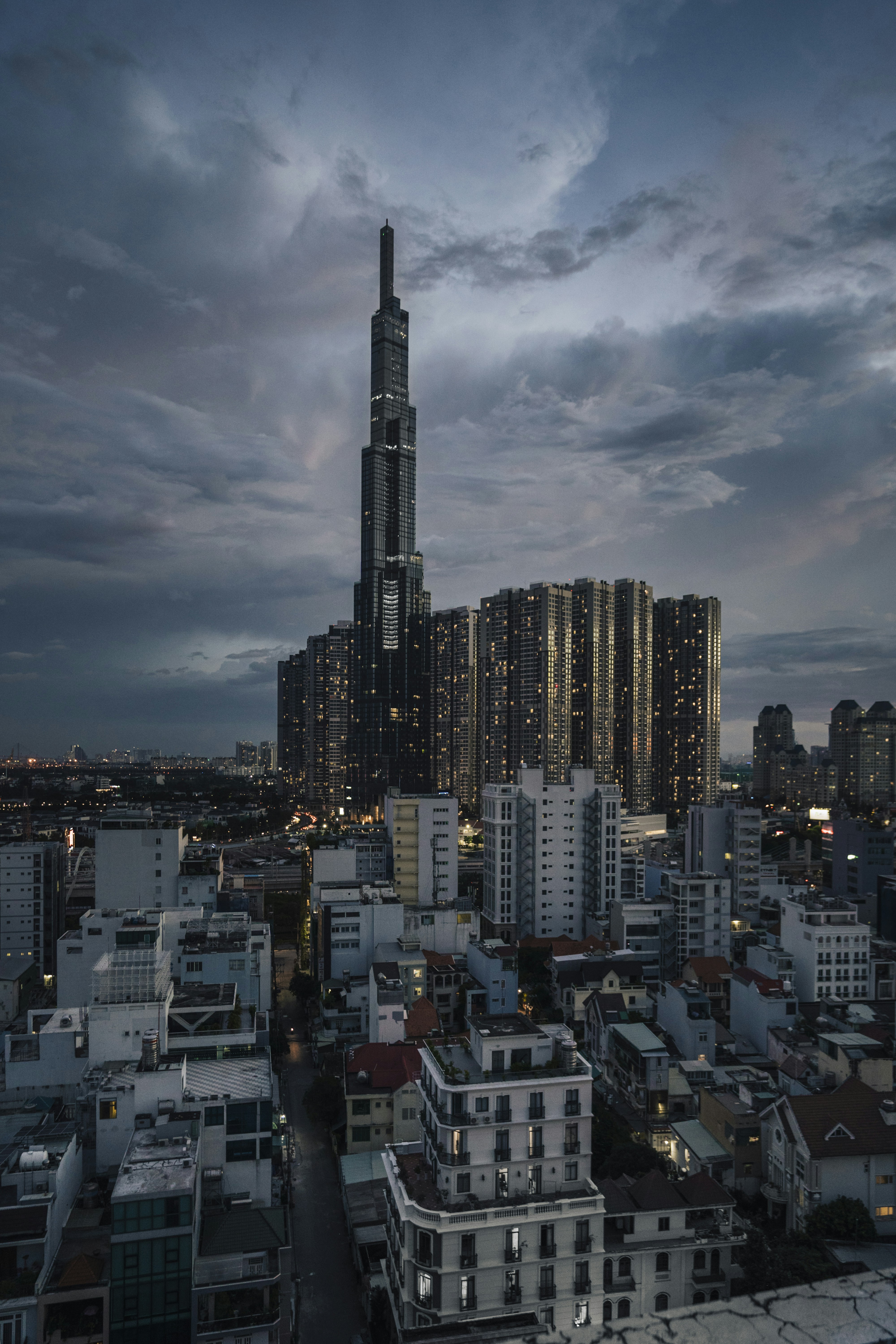city buildings under gray clouds during daytime