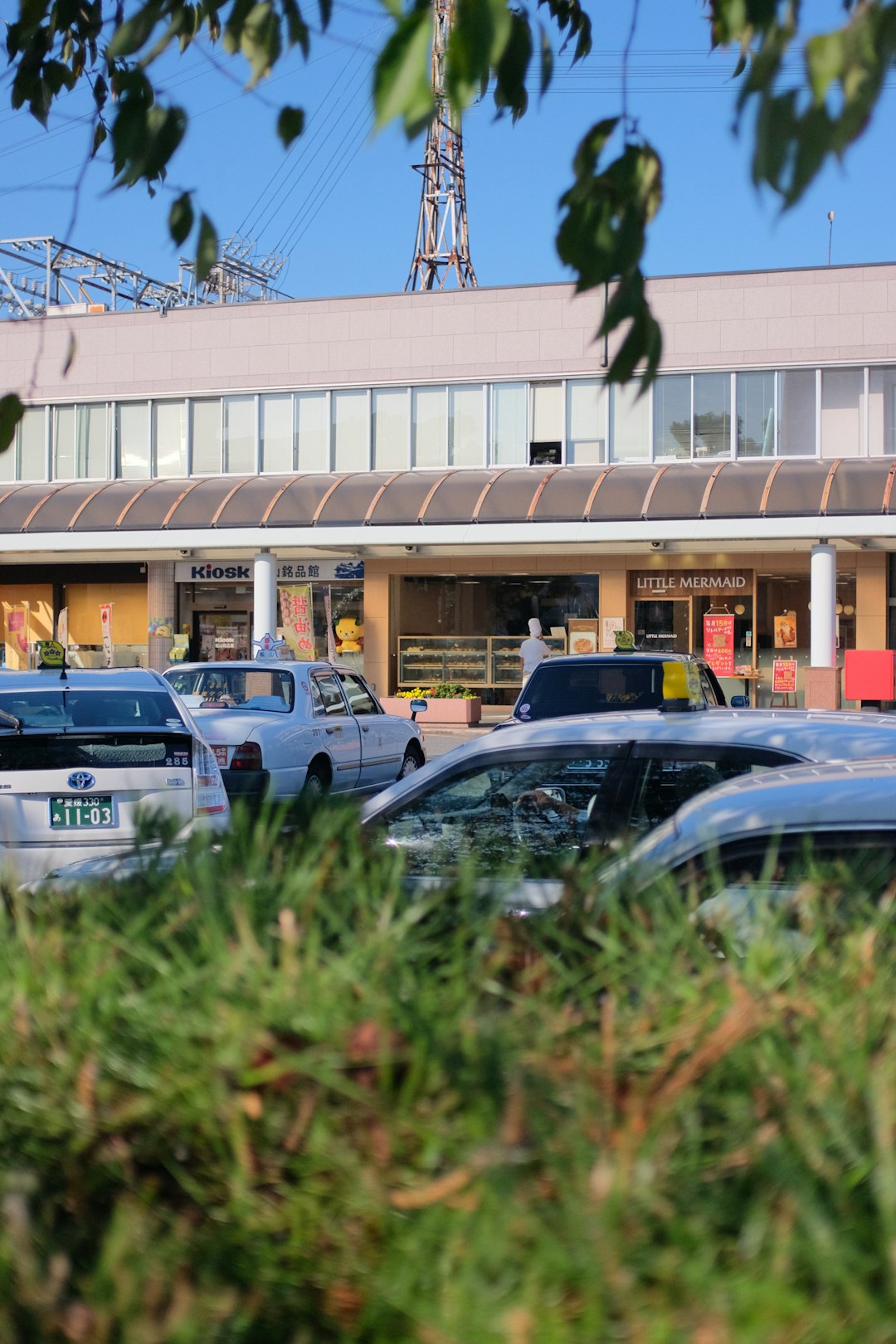 cars parked in front of building during daytime