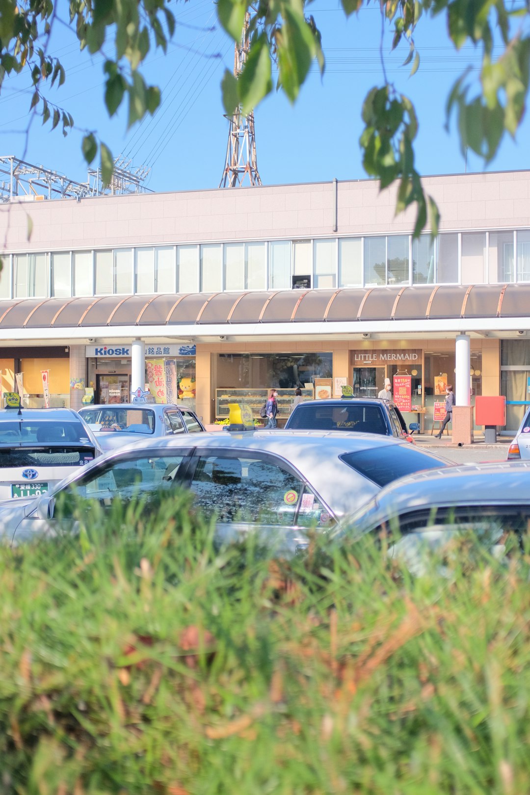 cars parked in front of building during daytime