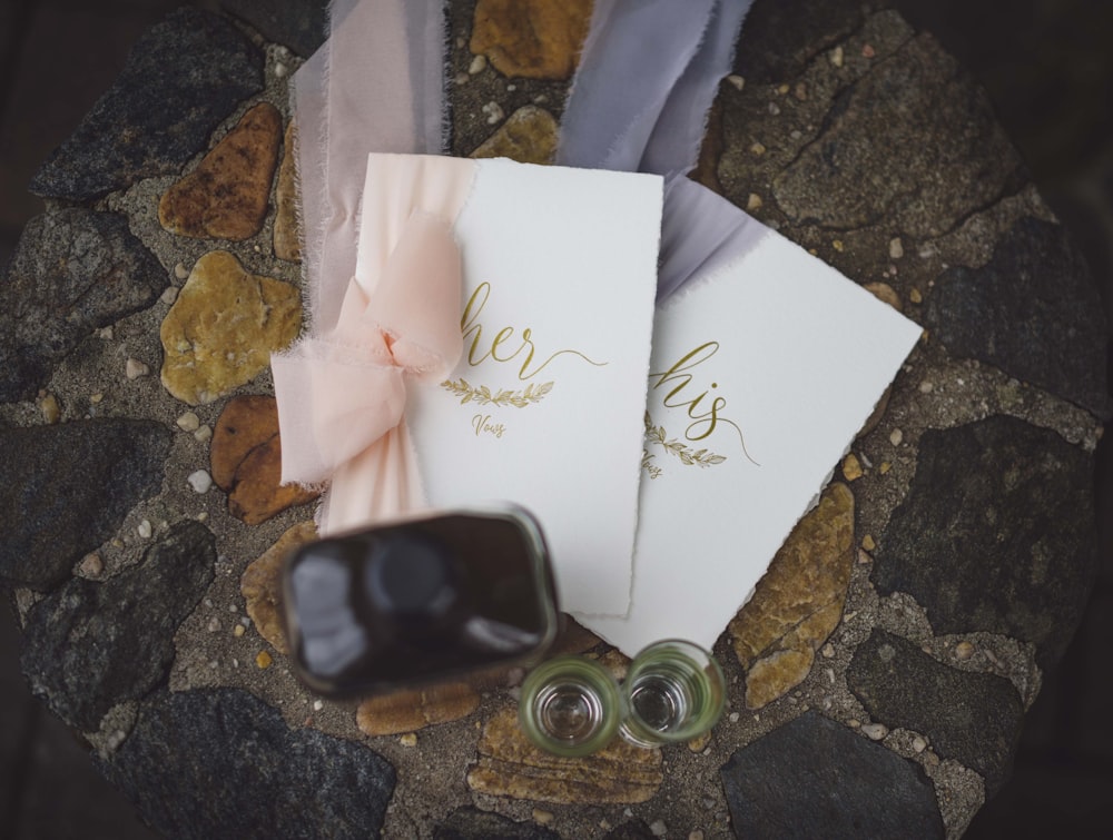 white greeting card on brown marble table