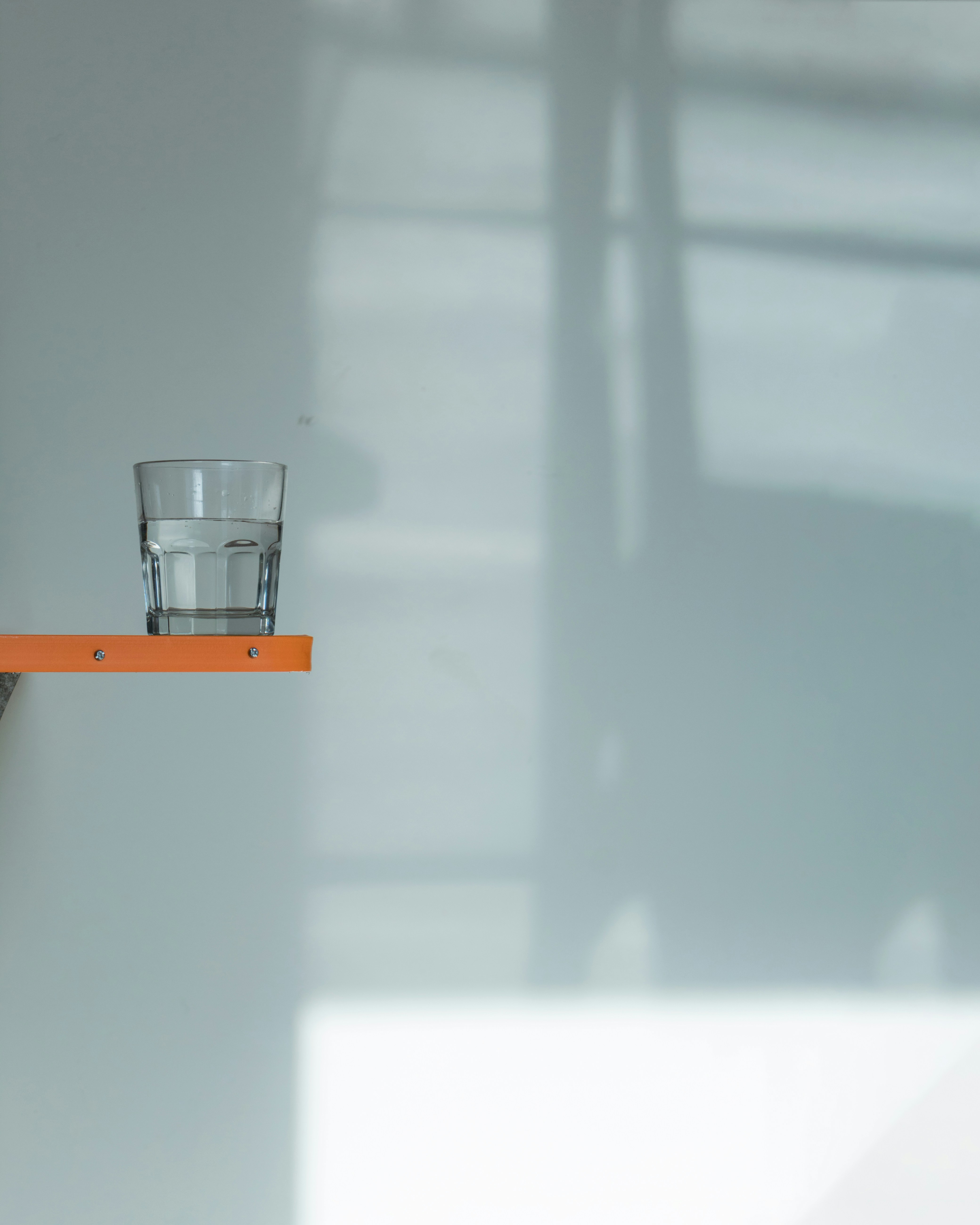 stainless steel cup on white table