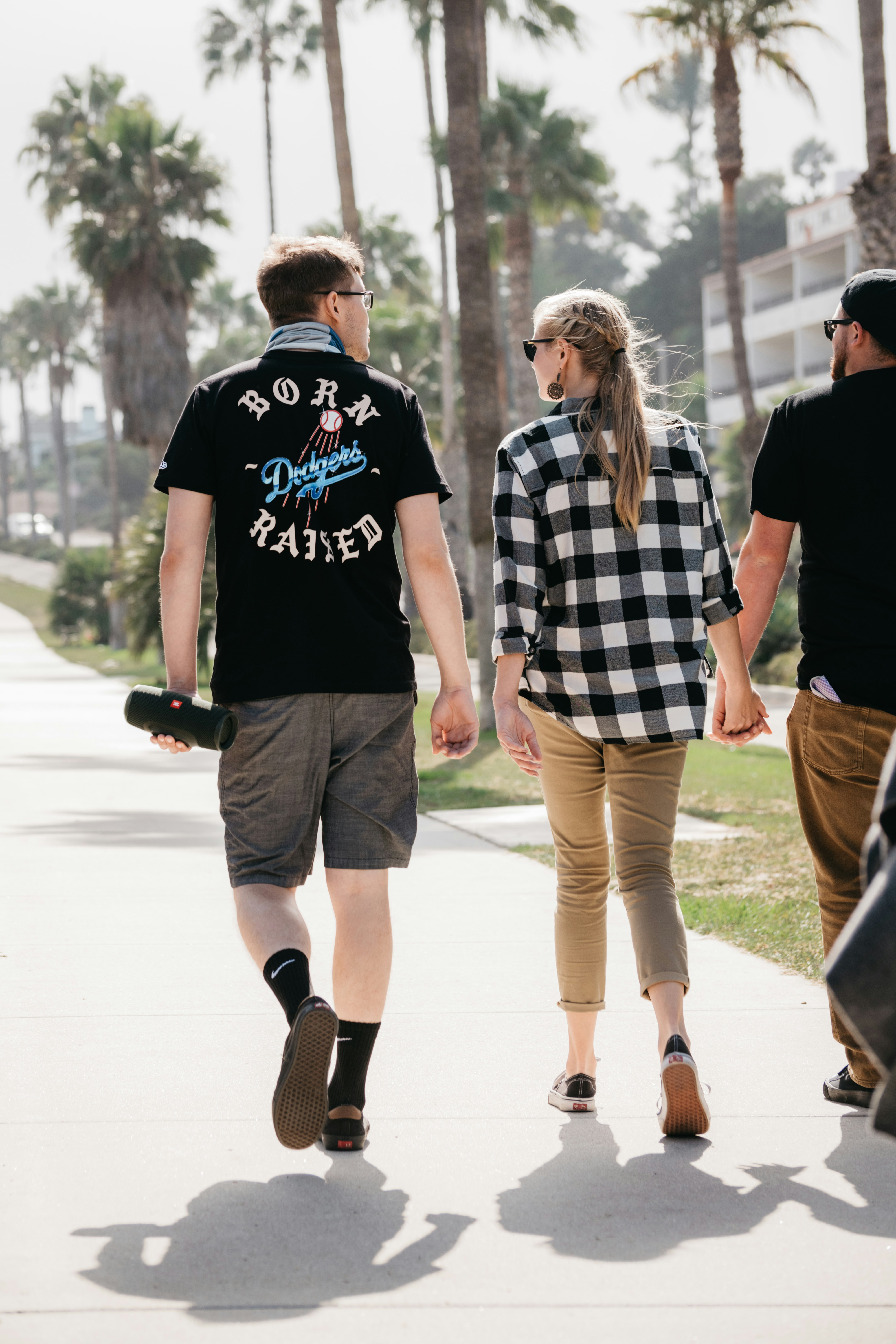 man in black crew neck t-shirt and woman in white and black checkered dress