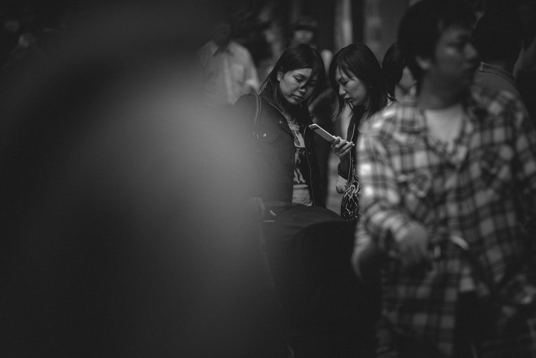 grayscale photo of woman in sleeveless dress, Two young Japanese women.