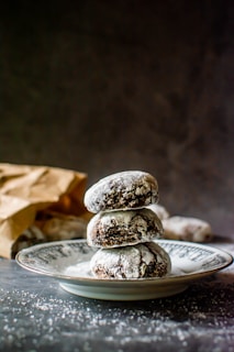 white and brown cookies on silver round plate