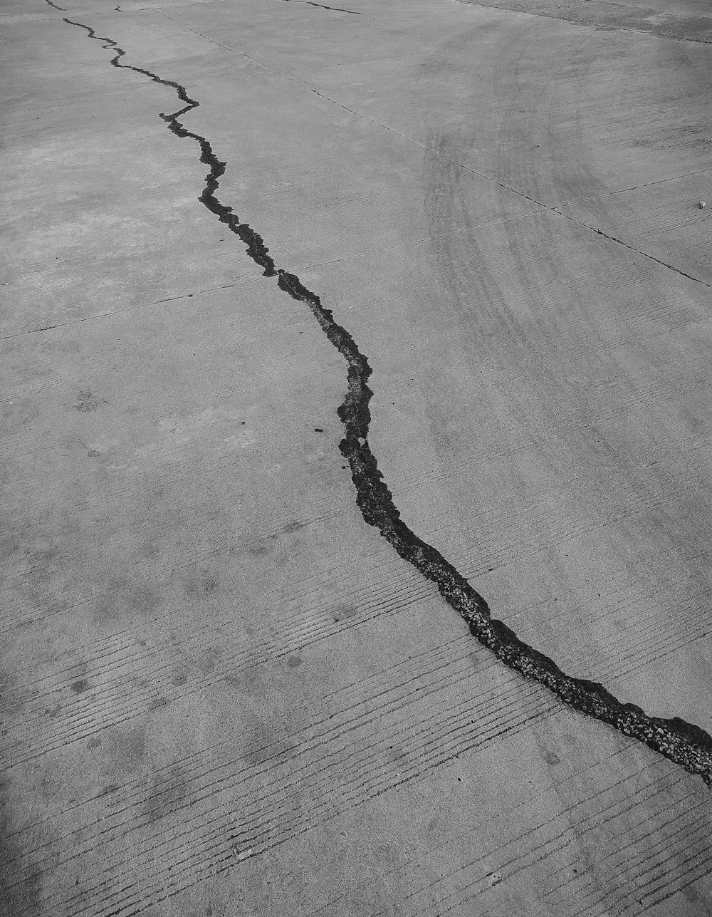 grayscale photo of a wooden floor