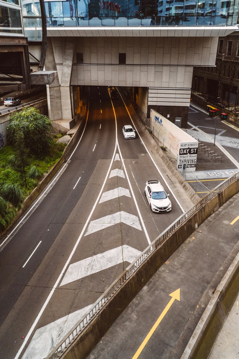 white car on gray asphalt road during daytime