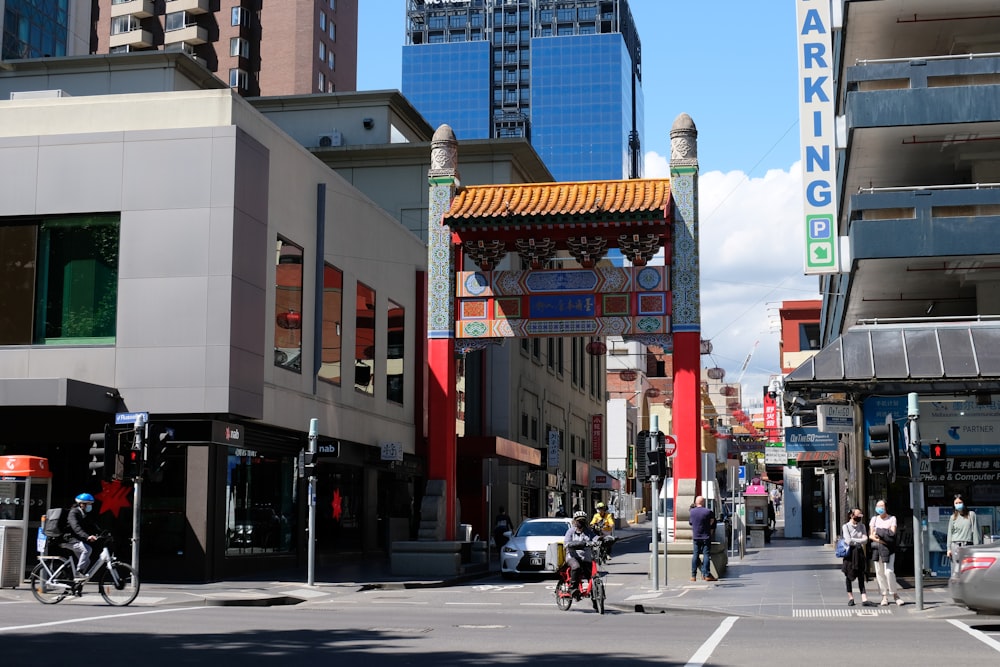 people walking on pedestrian lane near brown concrete building during daytime