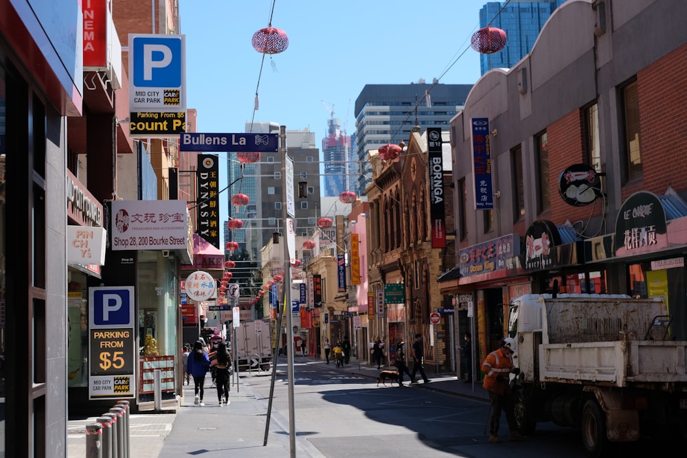 people walking on sidewalk during daytime