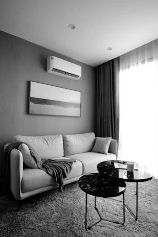 white and black sofa chair beside round table