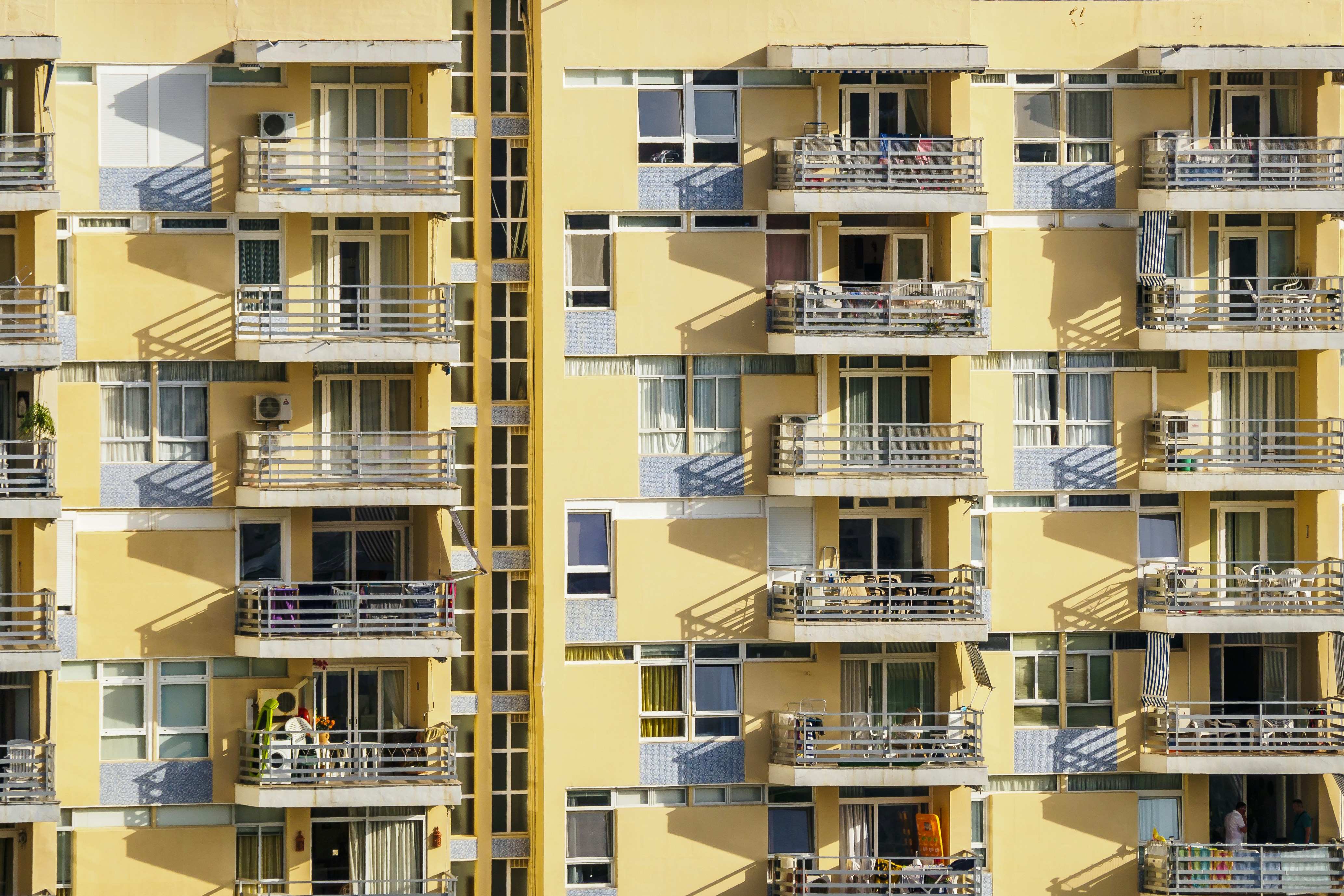 white-and-yellow-concrete-building