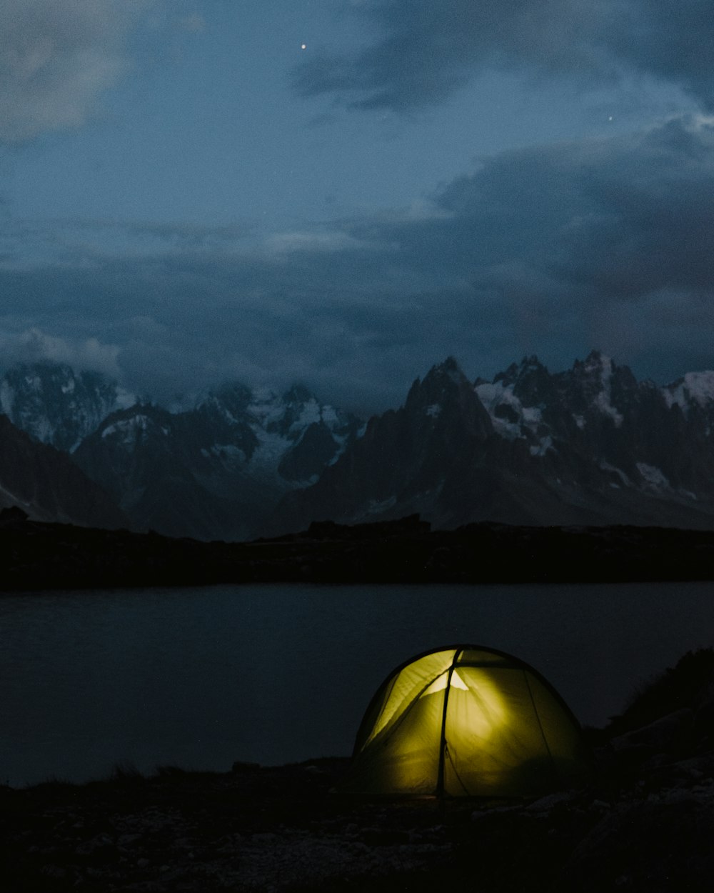 yellow dome tent on lake