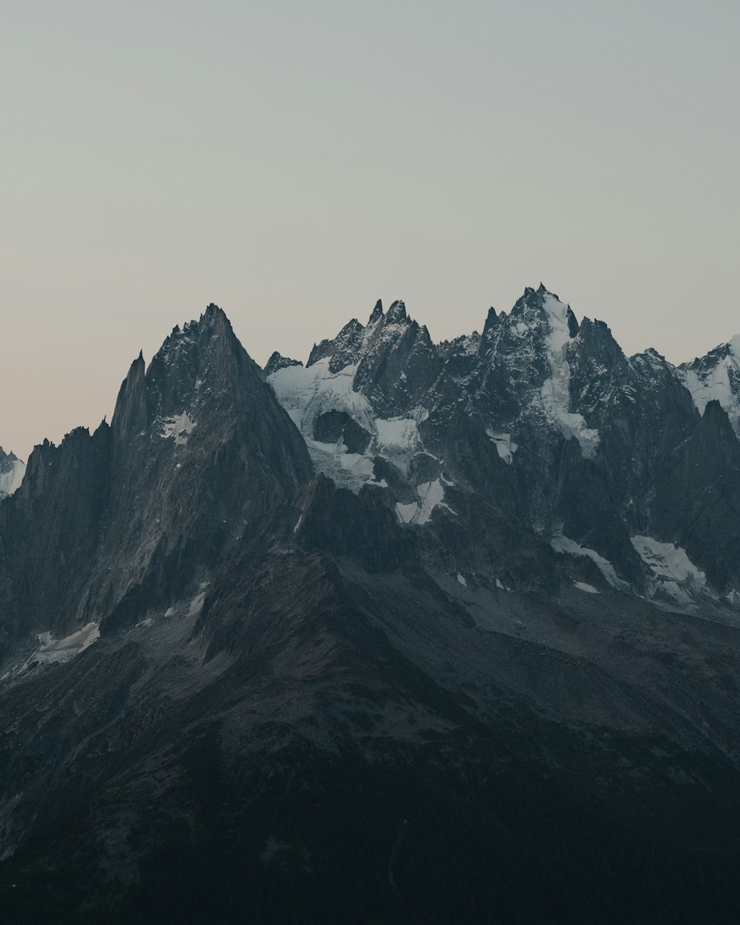 black and white mountain under white sky