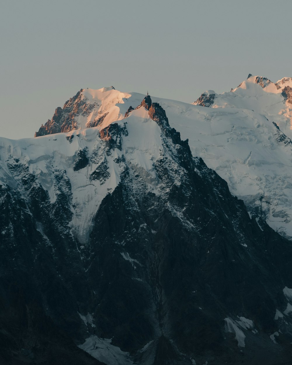 snow covered mountain during daytime