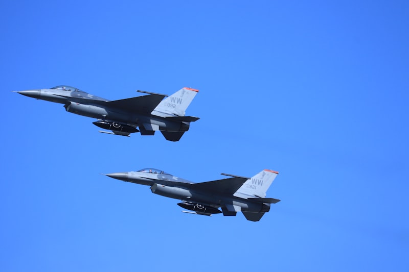 Two F-16 fighter jets in formation