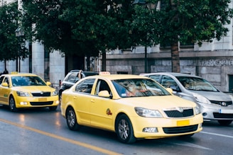 yellow taxi cab on the street