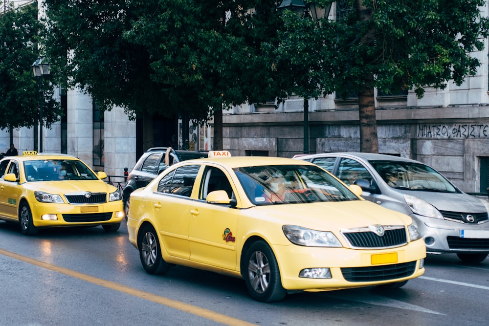 yellow taxi cab on the street