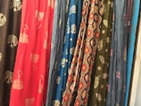 Close-up of colorful fabric textures arranged in an artistic pattern.