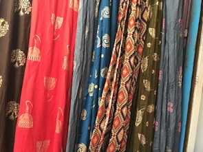 Close-up of colorful fabric textures arranged in an artistic pattern.