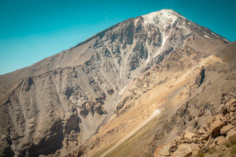 brown and white mountain under blue sky during daytime