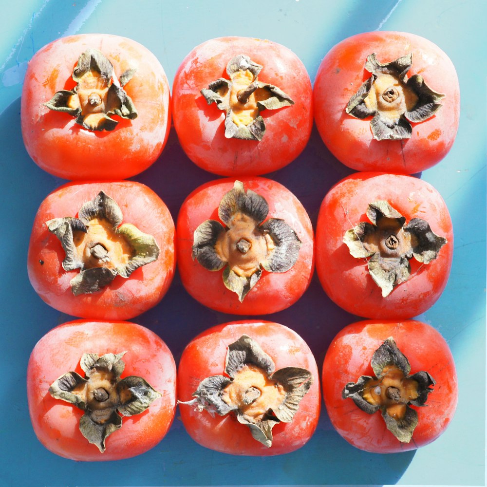 red tomatoes on white ceramic plate