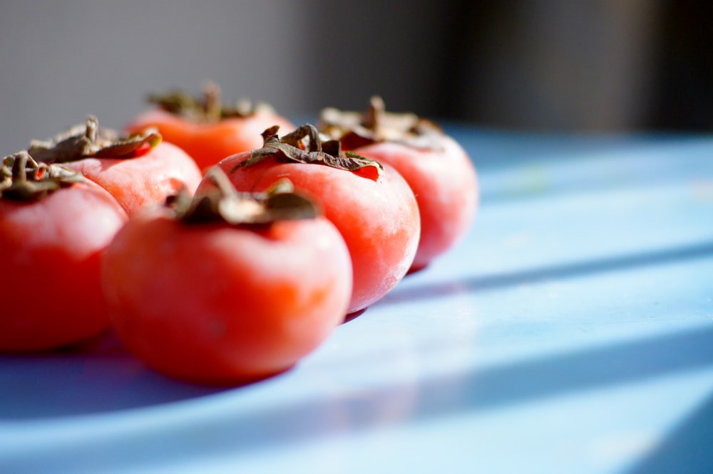 red tomato on blue table