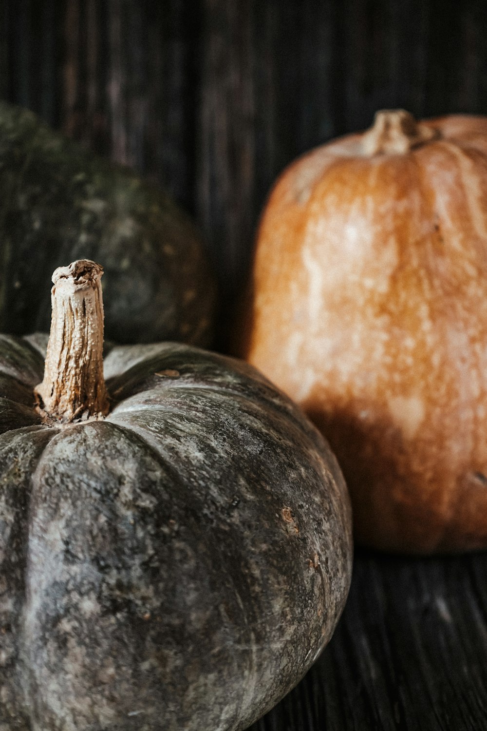 orange pumpkin on brown wooden table