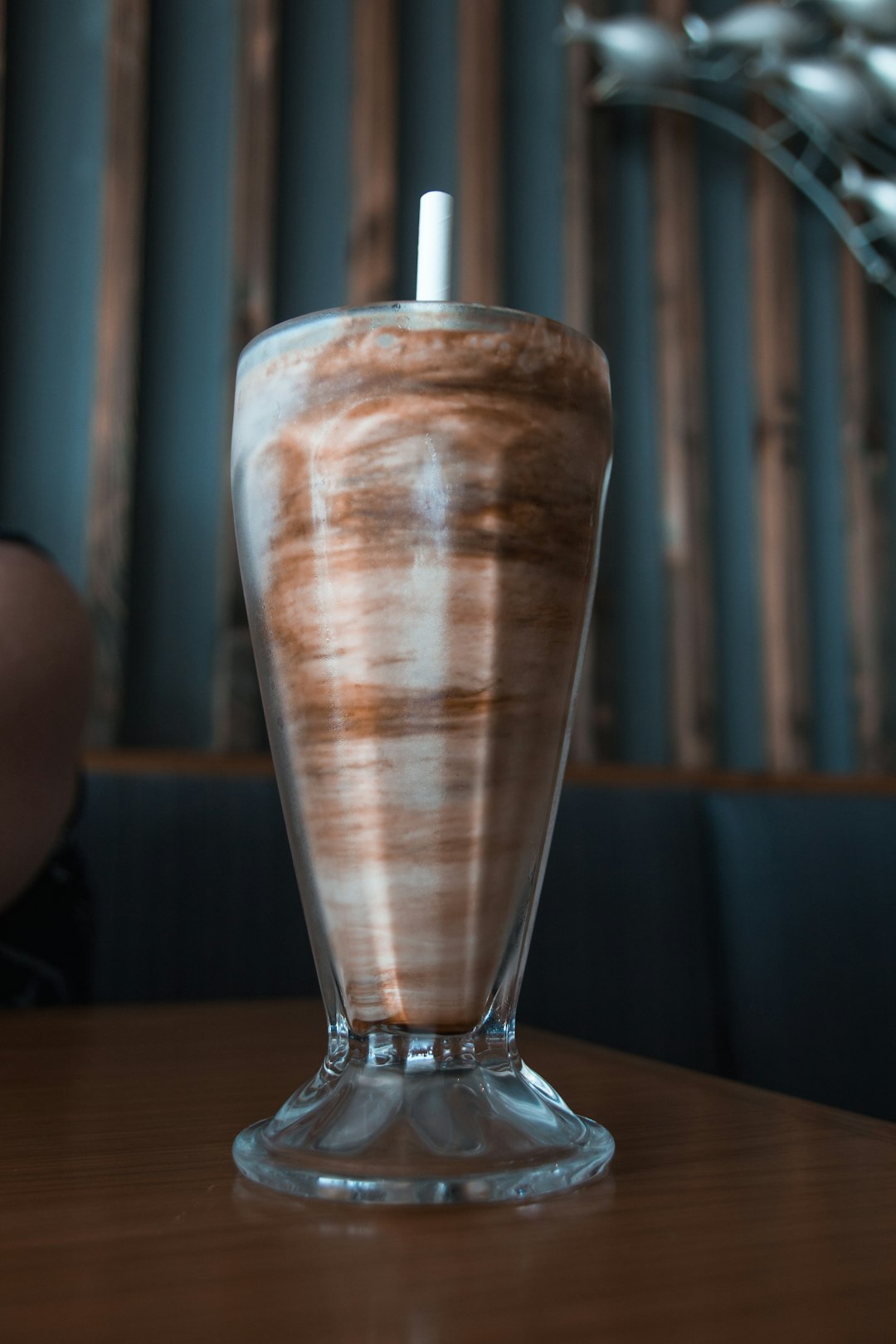 clear drinking glass on brown wooden table