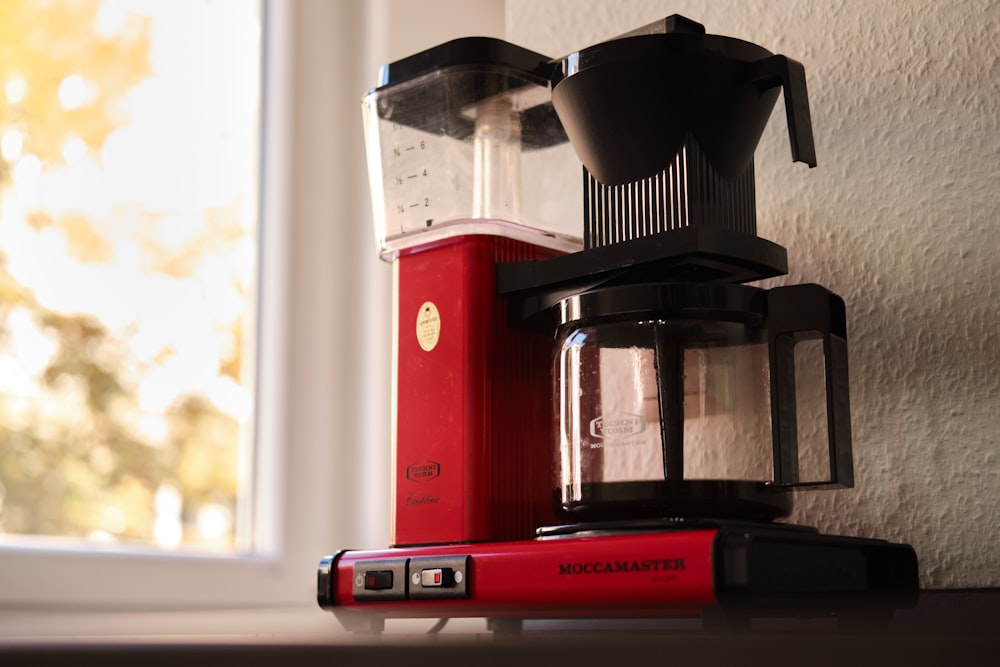 red and black coffee maker