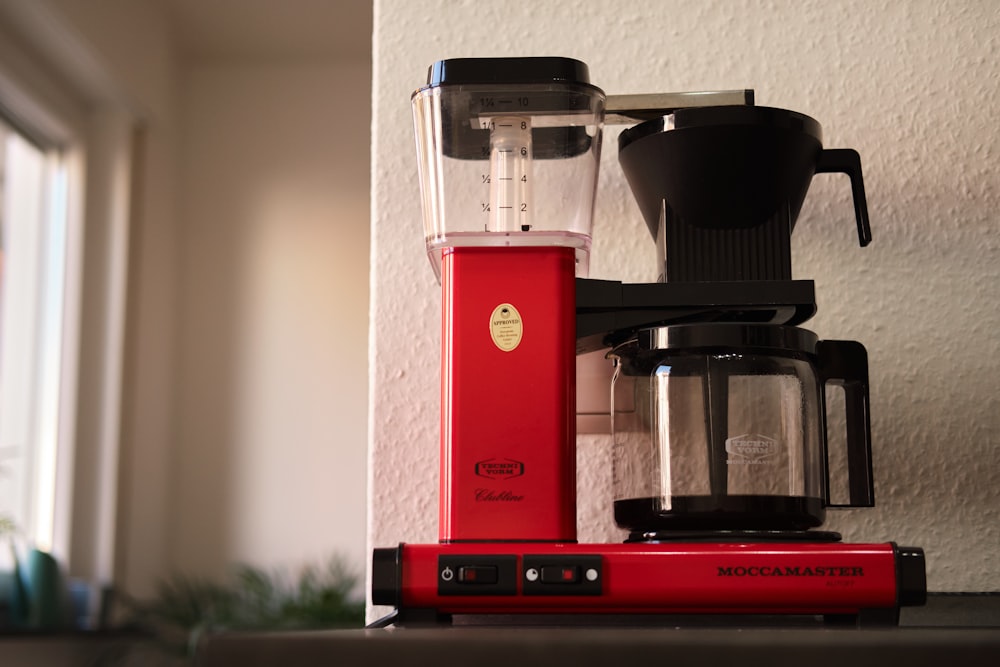 red and black coffee maker