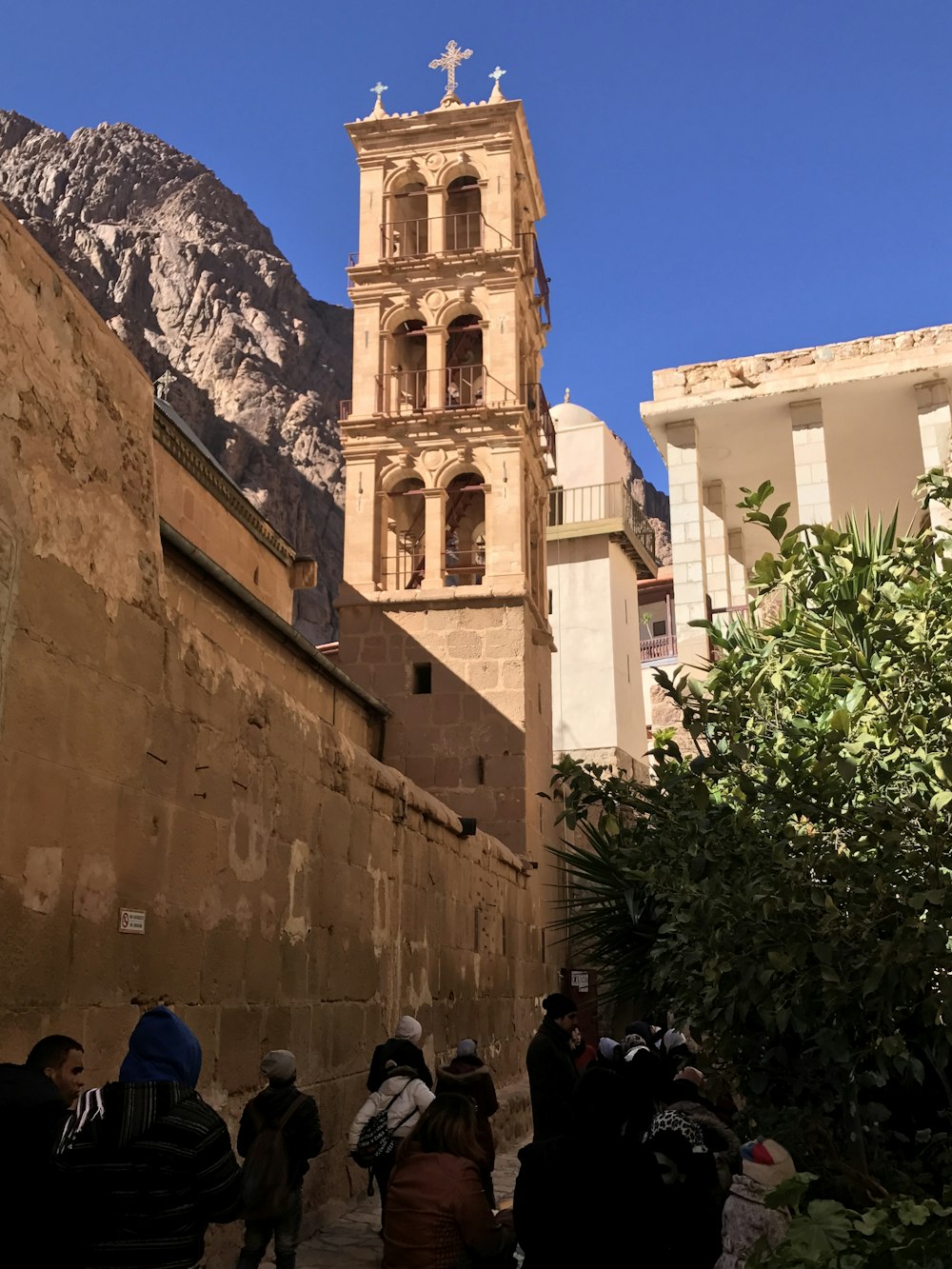 people walking near beige concrete building during daytime