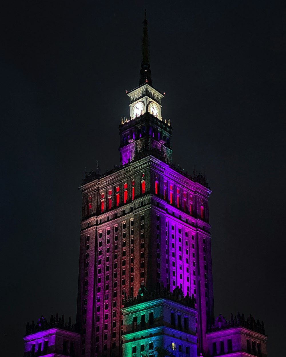 pink and green concrete building during nighttime