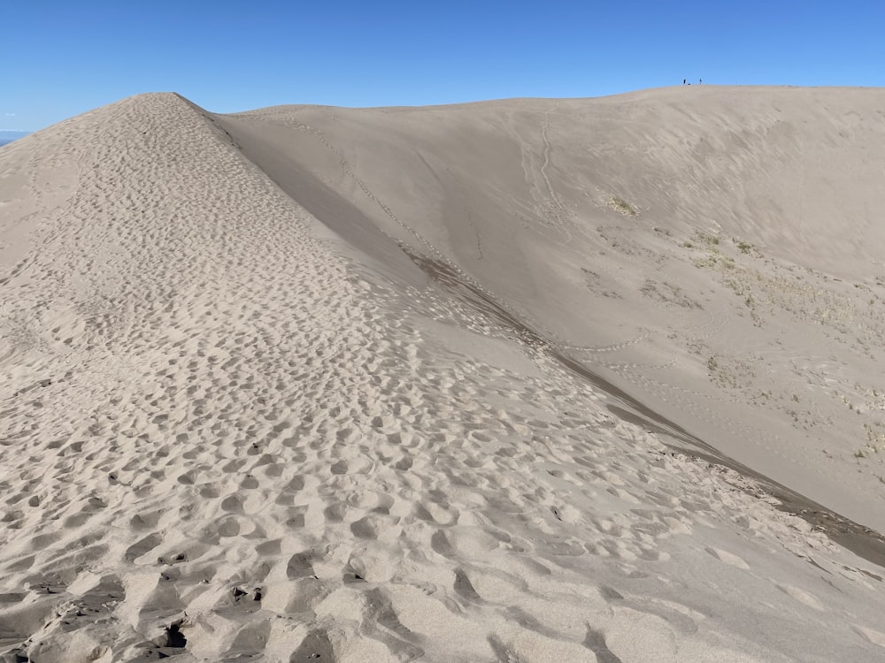 white sand under blue sky during daytime